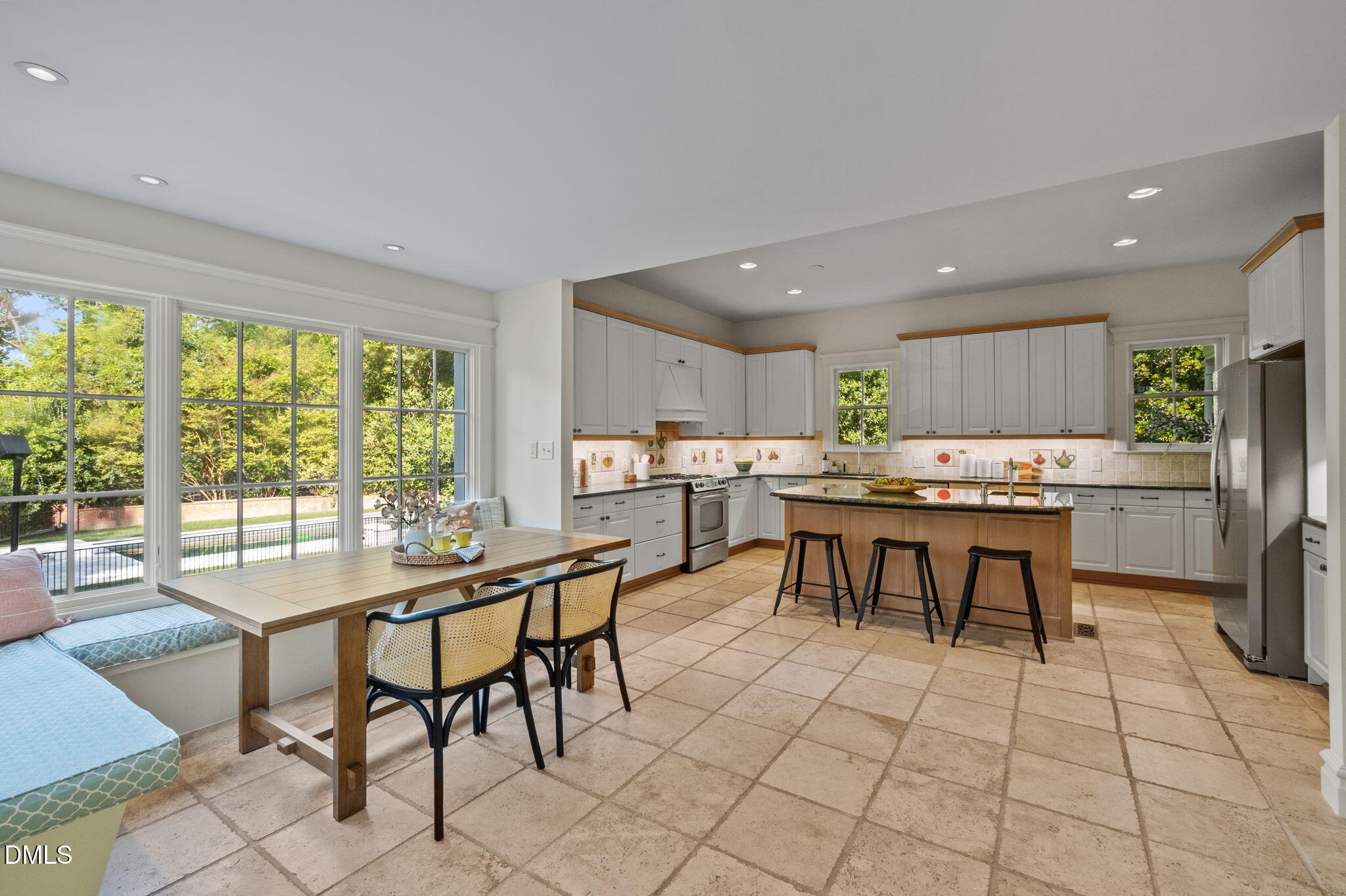 400 Ransom Street Chapel Hill, NC 27516 - Photo 34 of 67 a room with stainless steel appliances a table and chairs in it