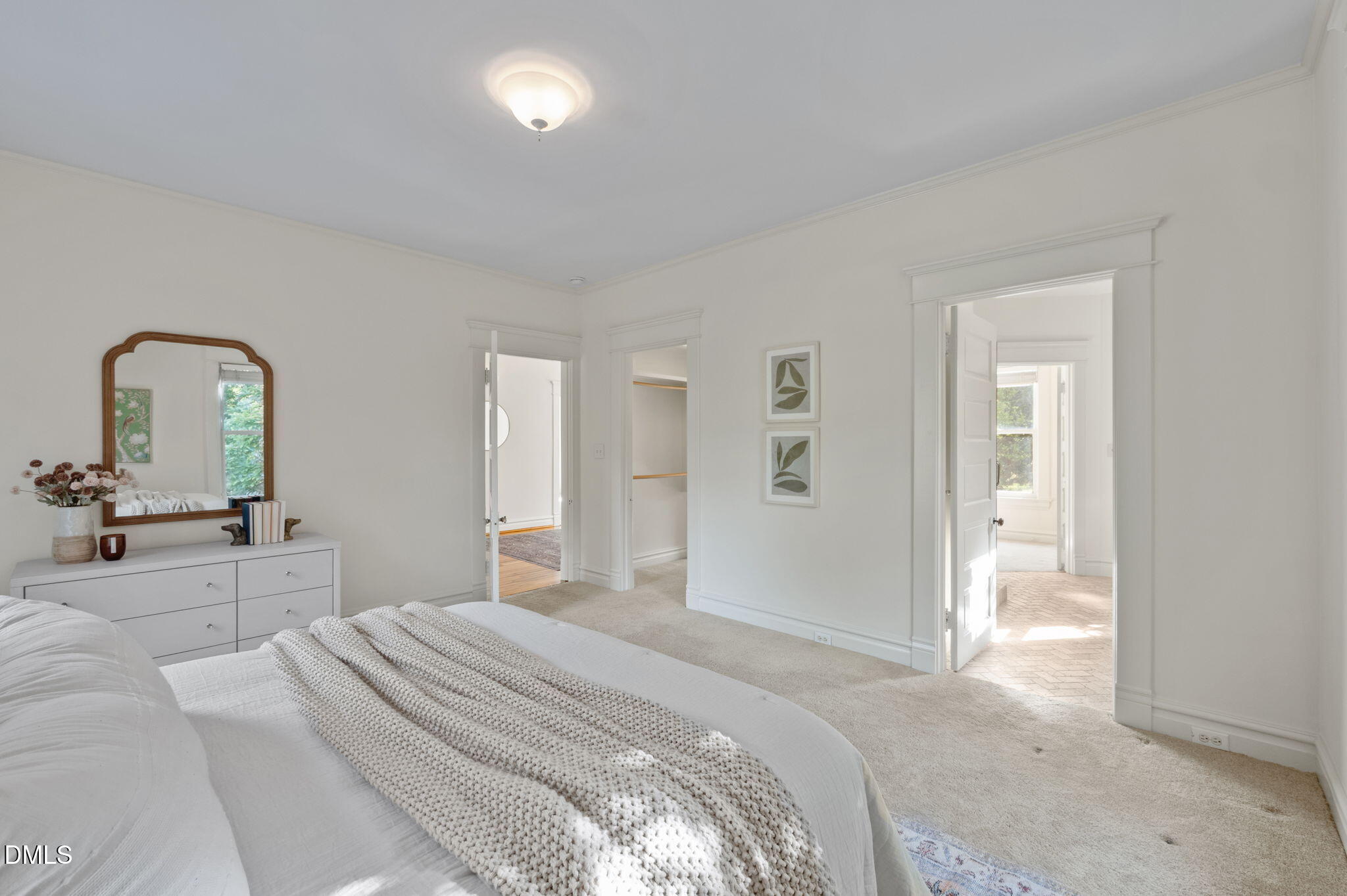 400 Ransom Street Chapel Hill, NC 27516 - Photo 41 of 67 a bedroom with a bed and a mirror