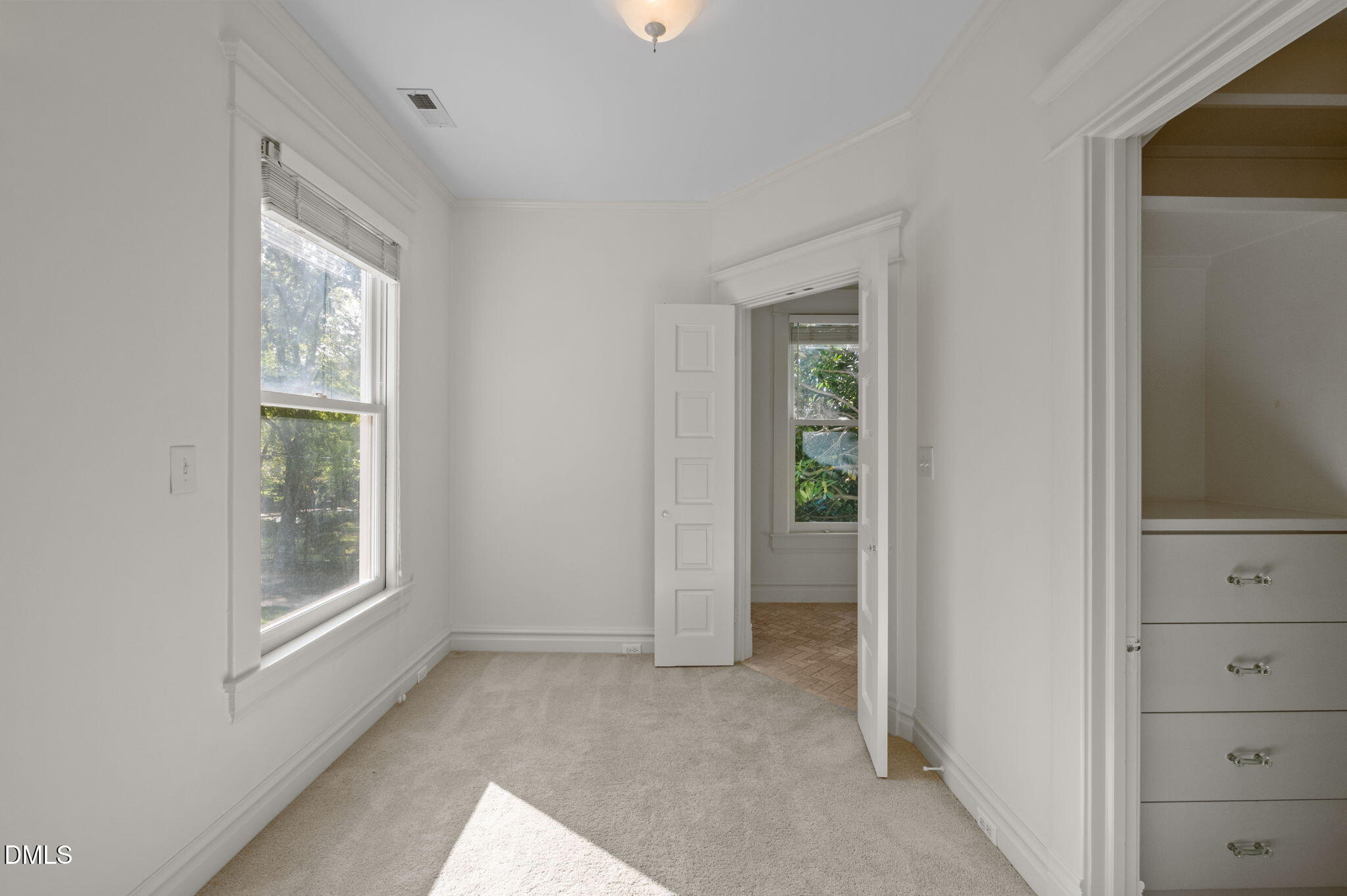 400 Ransom Street Chapel Hill, NC 27516 - Photo 44 of 67 a view of an empty room with closet and a window