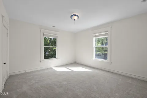 a view of a lake with a yard