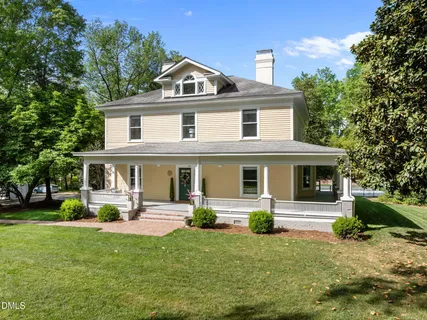 a view of house with yard