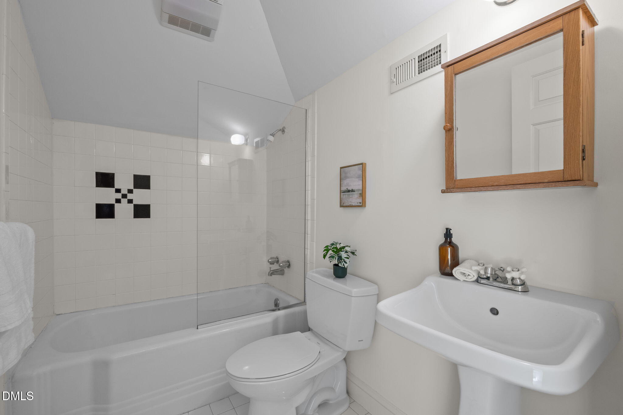 400 Ransom Street Chapel Hill, NC 27516 - Photo 53 of 67 a bath room with a toilet a sink and a bath tub