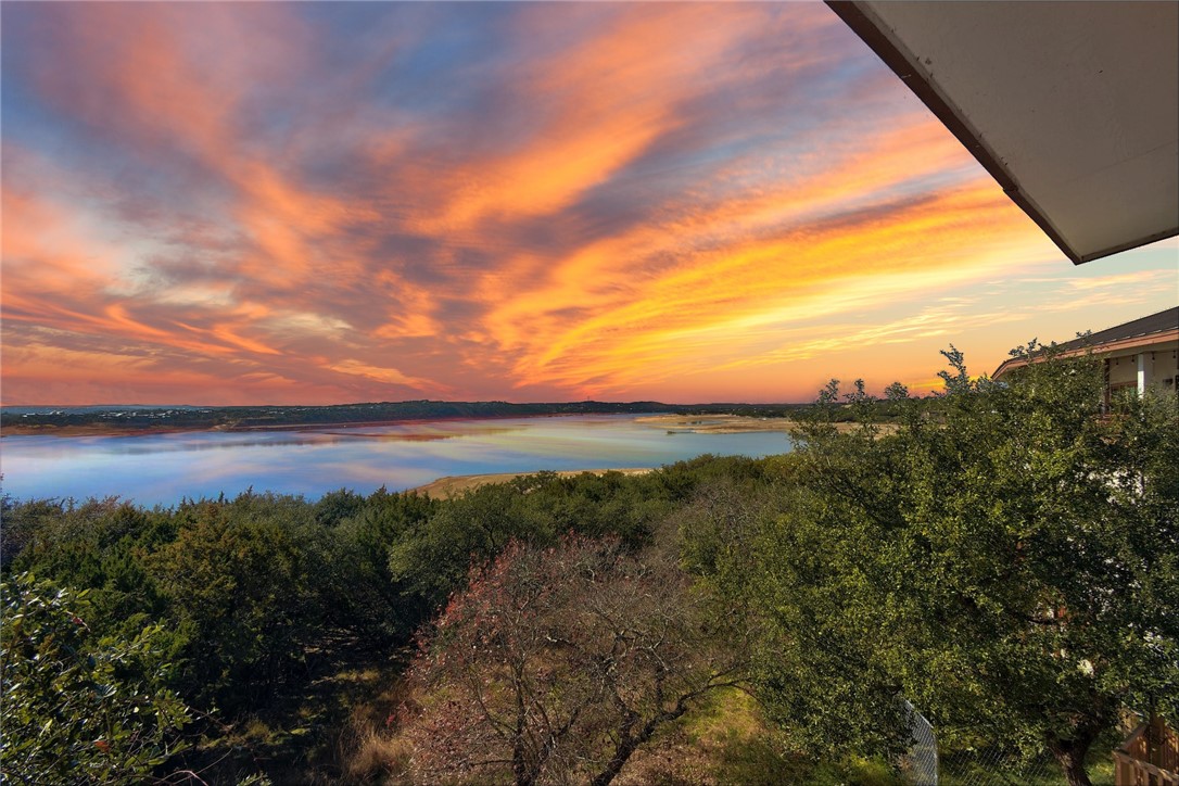 a view of a lake and sunset