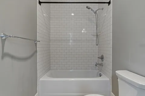 a bathroom with a shower and a bathtub