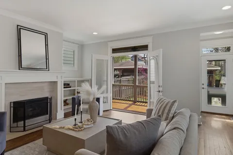 a living room with furniture and a fireplace