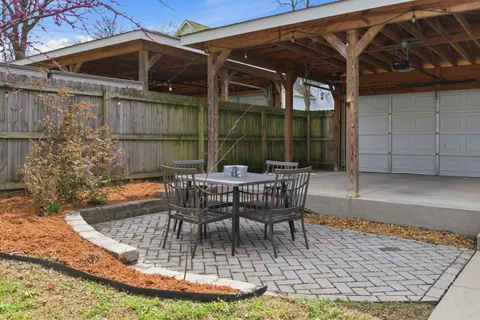 a view of a backyard with a patio