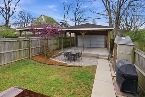 a view of a house with backyard porch and sitting area