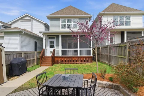 a view of a chair and table in the patio
