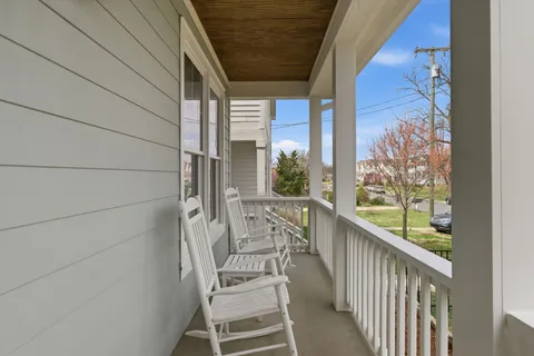 a view of balcony with furniture