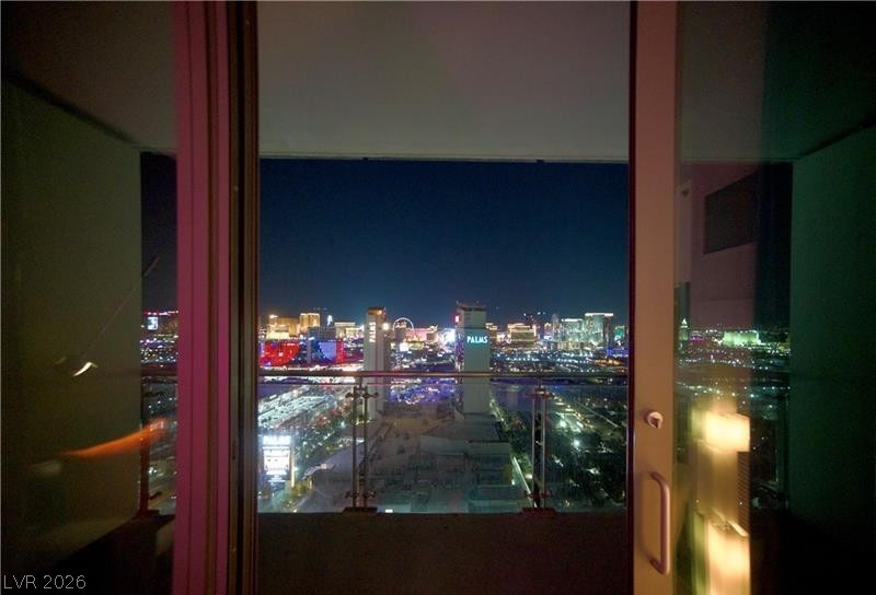 4381 West Flamingo Road, Unit 2819 Las Vegas, NV 89103 - Photo 7 of 9 Vibrant city lights sparkle from this elevated perch, showcasing an engaging urban landscape.