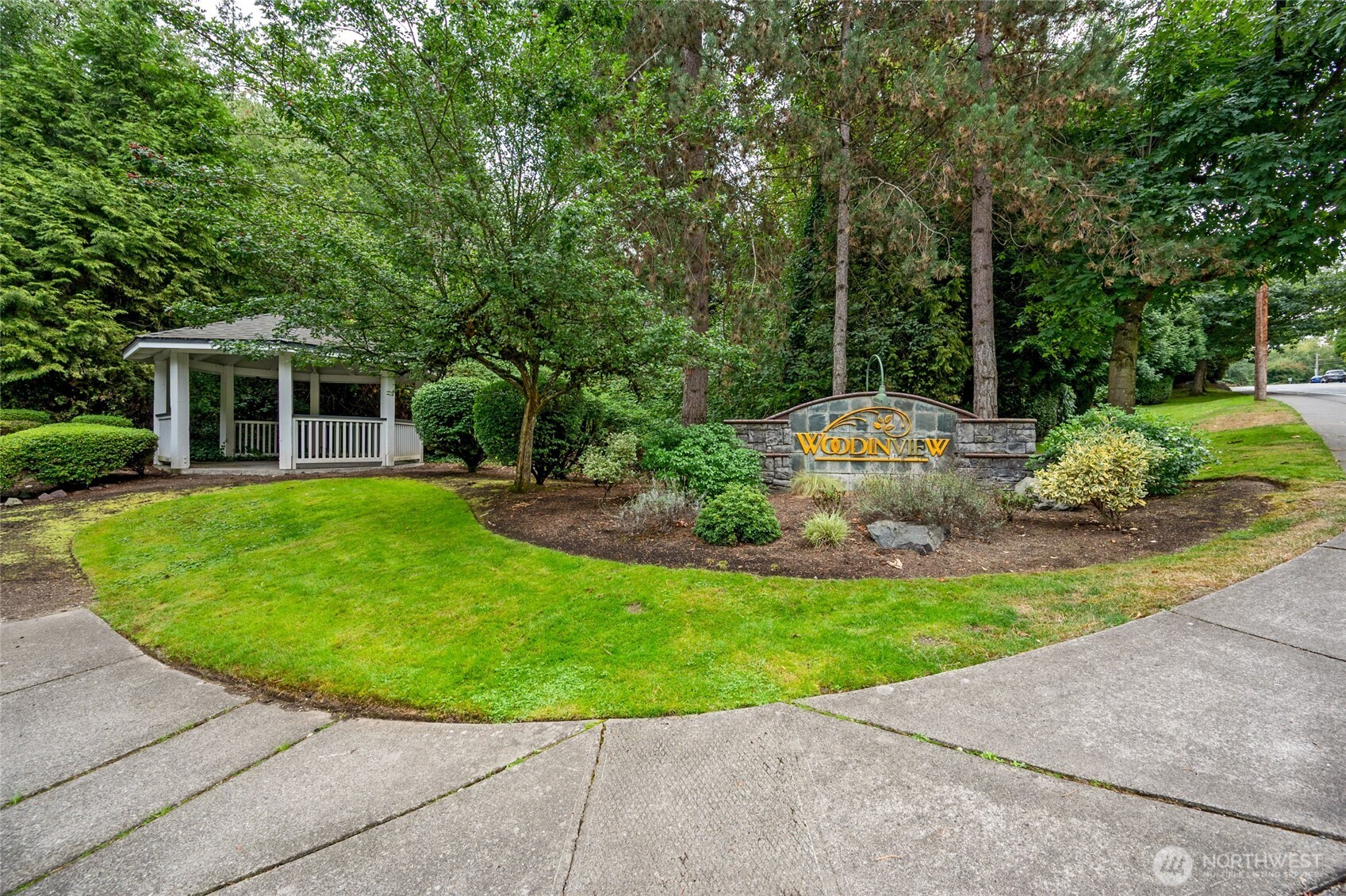 a view of a house with backyard sitting area and garden