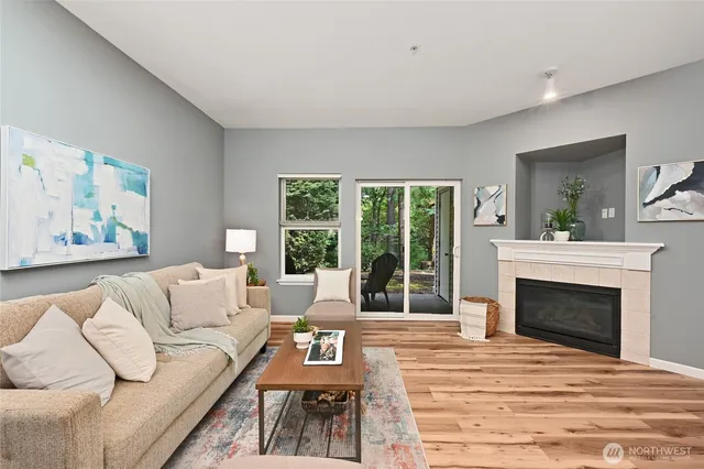 a living room with furniture and a fireplace