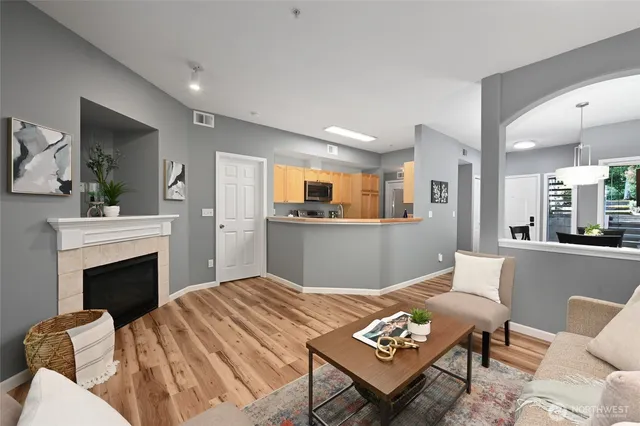 a living room with a couch and a fireplace