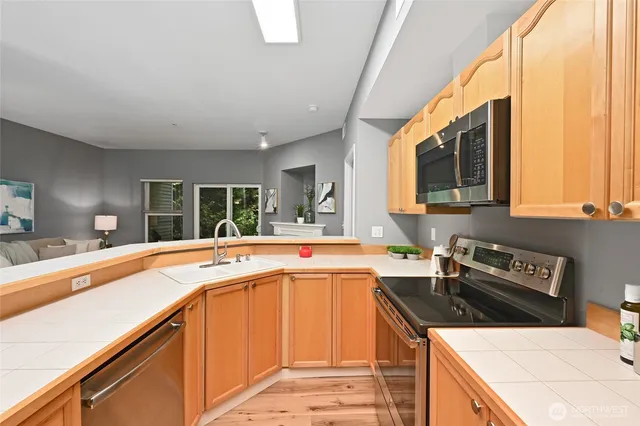 a kitchen that has a sink and a stove