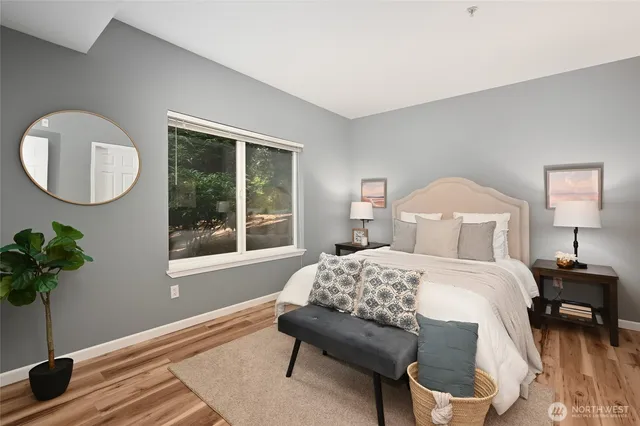 a bedroom with a bed and a window