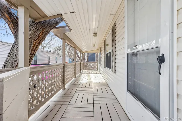 a view of balcony with wooden floor