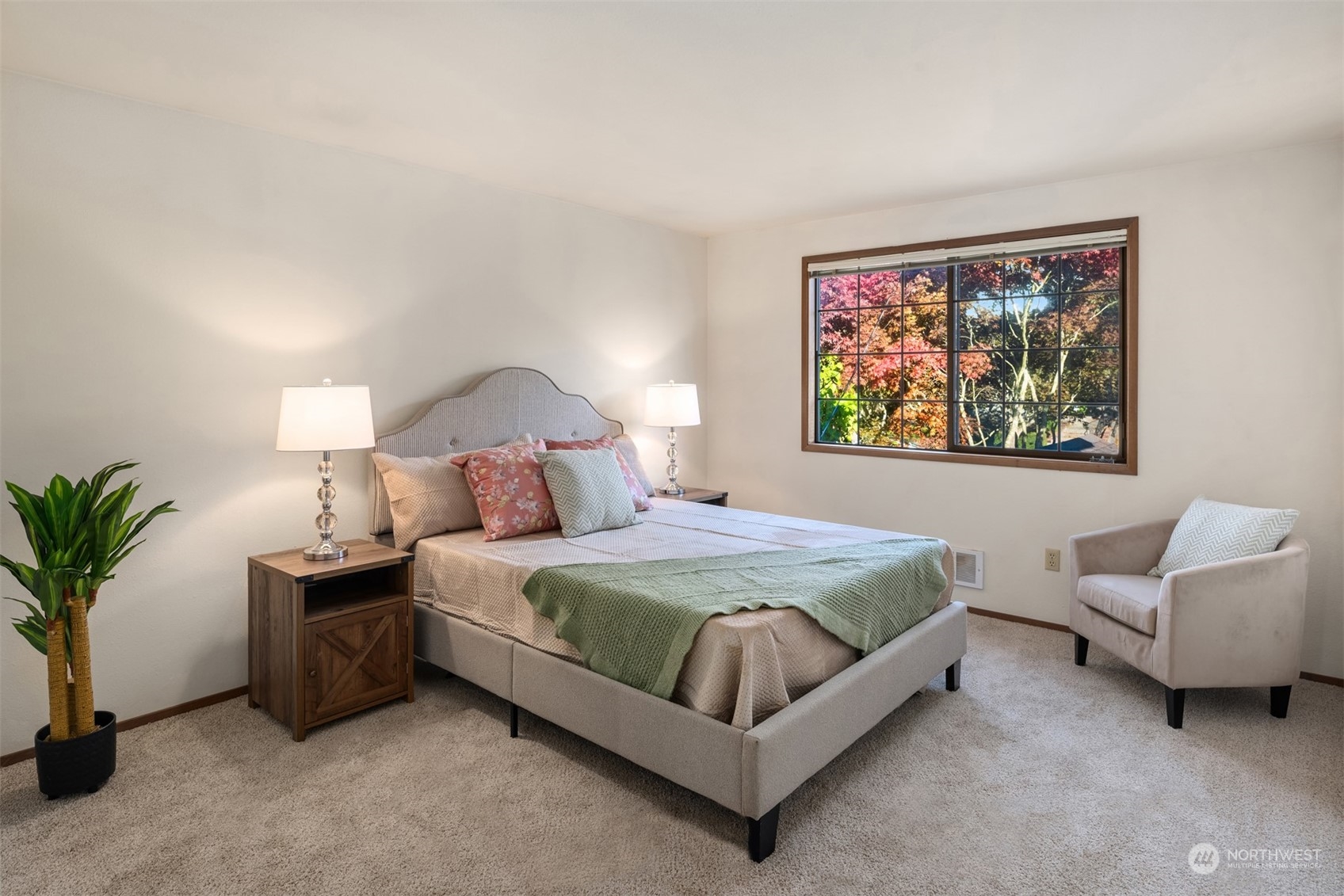 6049 5th Avenue Northwest Seattle, WA 98107 - Photo 12 of 22 a spacious bedroom with a bed a couch and potted plant on the dresser