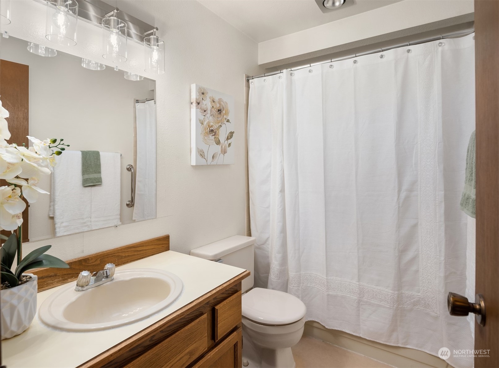 6049 5th Avenue Northwest Seattle, WA 98107 - Photo 13 of 22 a bathroom with a sink toilet and shower