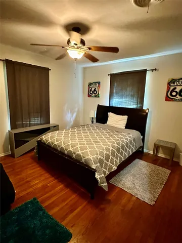 a bedroom with two beds and painted walls