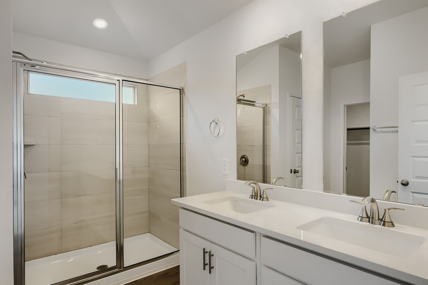 146 Diablo Rim Terrace Dripping Springs, TX 78620 - Photo 5 of 32 Dual vanity sinks complement a spacious walk-in shower in this well-appointed bathroom.