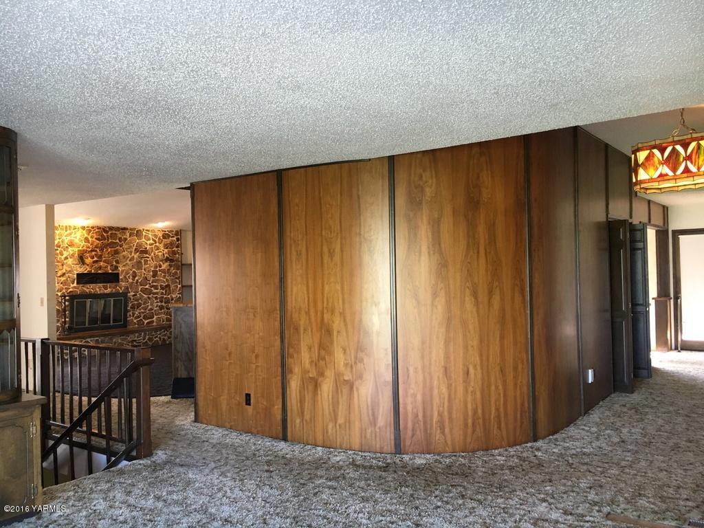 2571 Ashue Road Wapato, WA 98951 - Photo 18 of 33 a view of a room with large windows and wooden floor