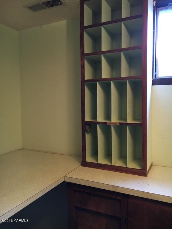 2571 Ashue Road Wapato, WA 98951 - Photo 26 of 33 a room with wooden floor and windows