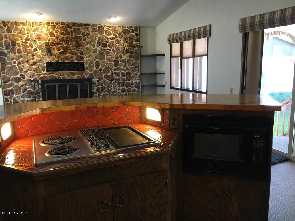 2571 Ashue Road Wapato, WA 98951 - Photo 5 of 33 a kitchen with a sink and cabinets