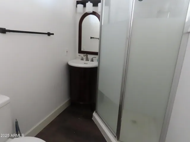 a bathroom with a sink and mirror
