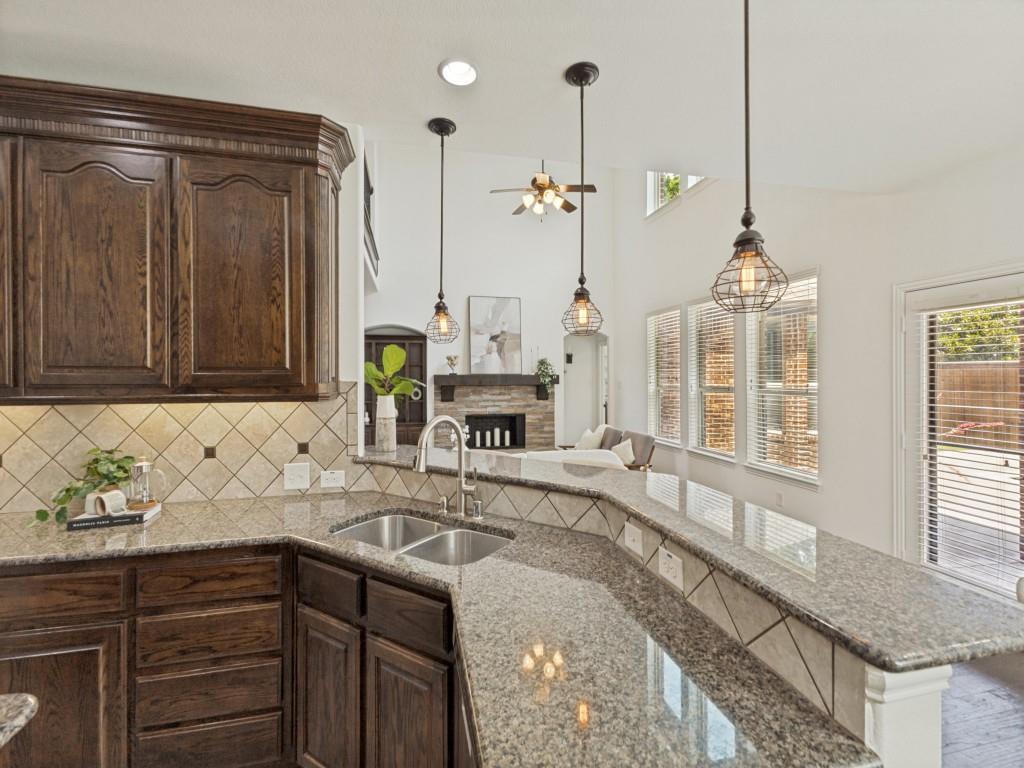 916 Redbird Lane Allen, TX 75013 - Photo 11 of 28 Kitchen overlooking the living room so no one feels left out when entertaining.