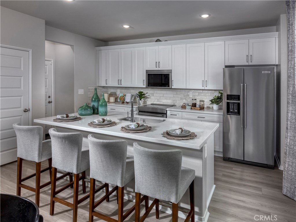 934 Fuchsia Circle Redlands, CA 92374 - Photo 7 of 16 Photo is not of the actual home, but is an inspirational photo of builder’s model home and may depict options, furnishings, and/or decorator features that are not included