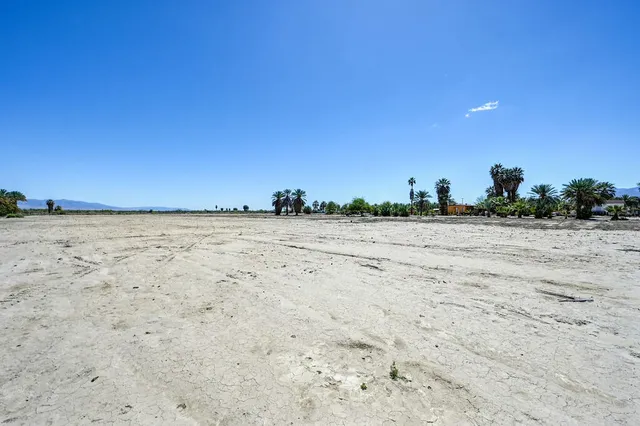 a view of a ocean with a mountain in the background