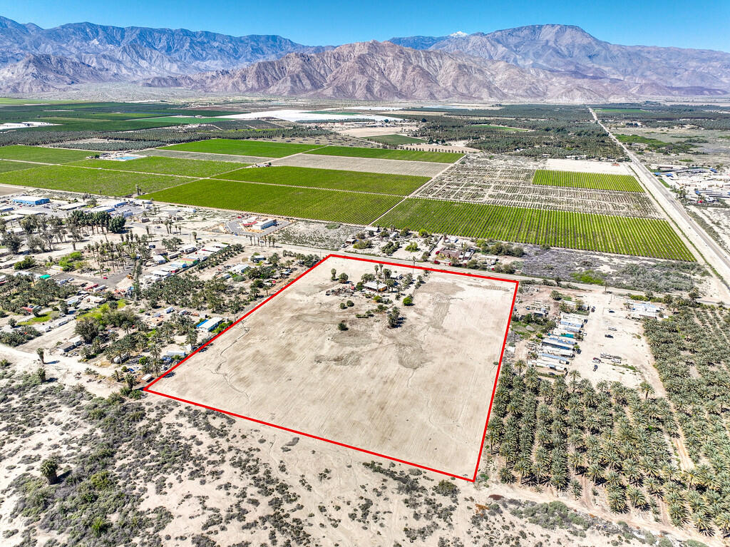 66350 Martinez Road Thermal, CA 92274 - Photo 28 of 68 a view of a swimming pool with a yard and a large mountain view