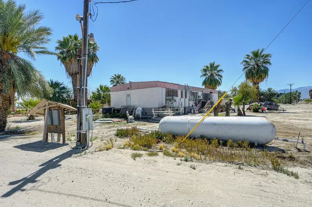 a view of a swimming pool with a patio