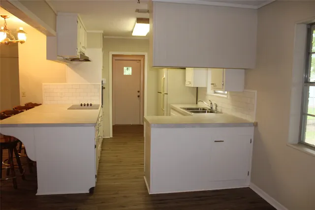 a bathroom with a sink a mirror and a shower