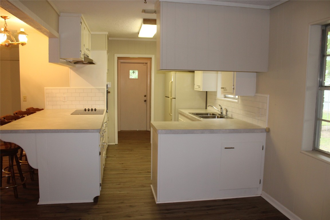708 1st Street Winnie, TX 77665 - Photo 14 of 35 a bathroom with a sink a mirror and a shower