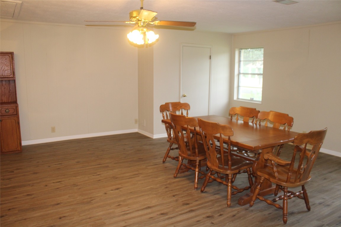 708 1st Street Winnie, TX 77665 - Photo 17 of 35 a view of a dining room with furniture and wooden floor