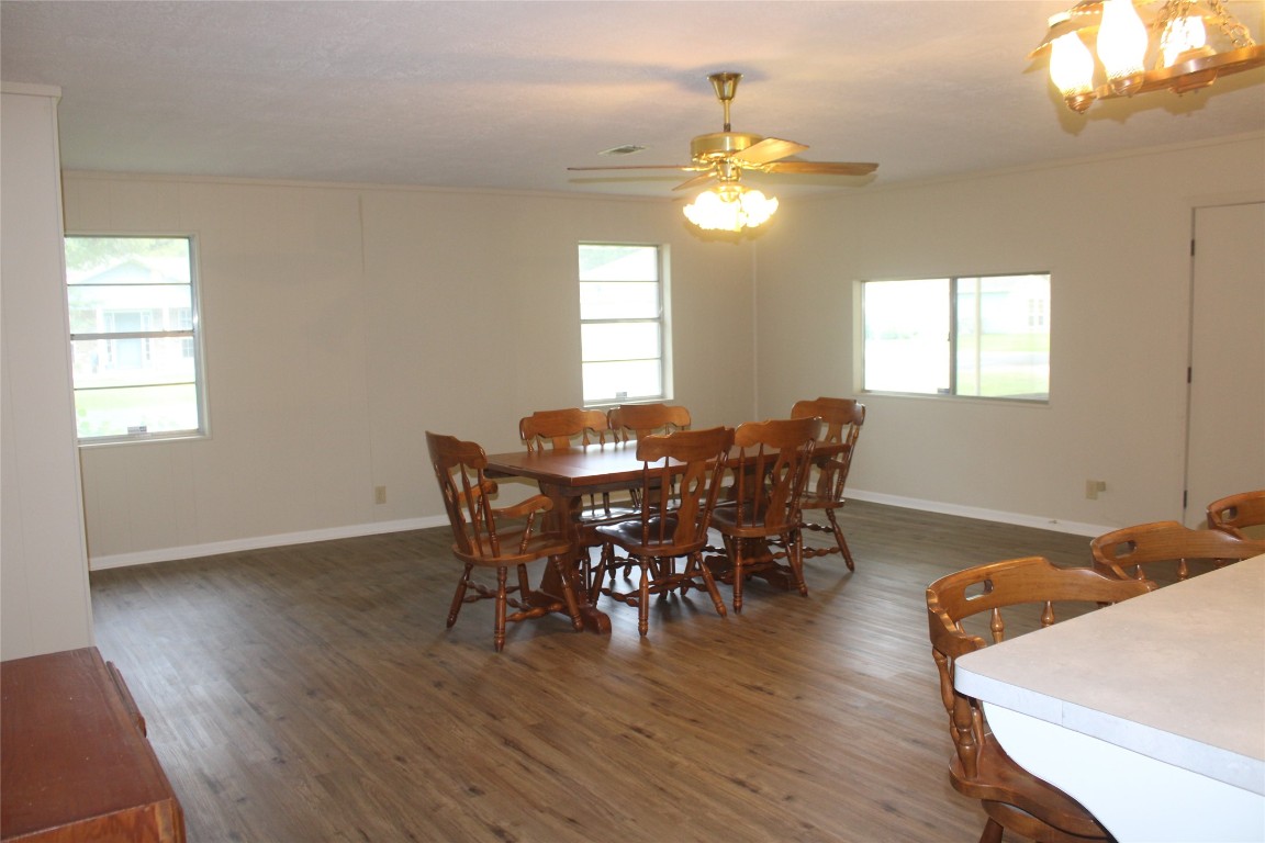 708 1st Street Winnie, TX 77665 - Photo 19 of 35 a view of a dining room with furniture and wooden floor