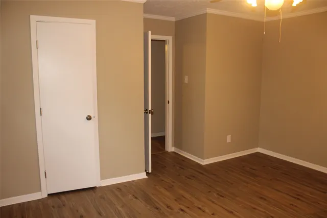 a view of a small space with wooden floor