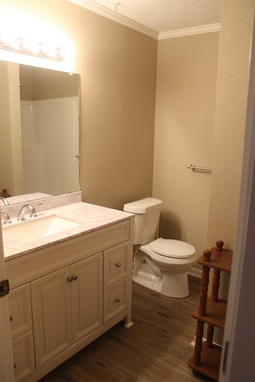 708 1st Street Winnie, TX 77665 - Photo 22 of 35 a bathroom with a toilet a sink a vanity and mirror