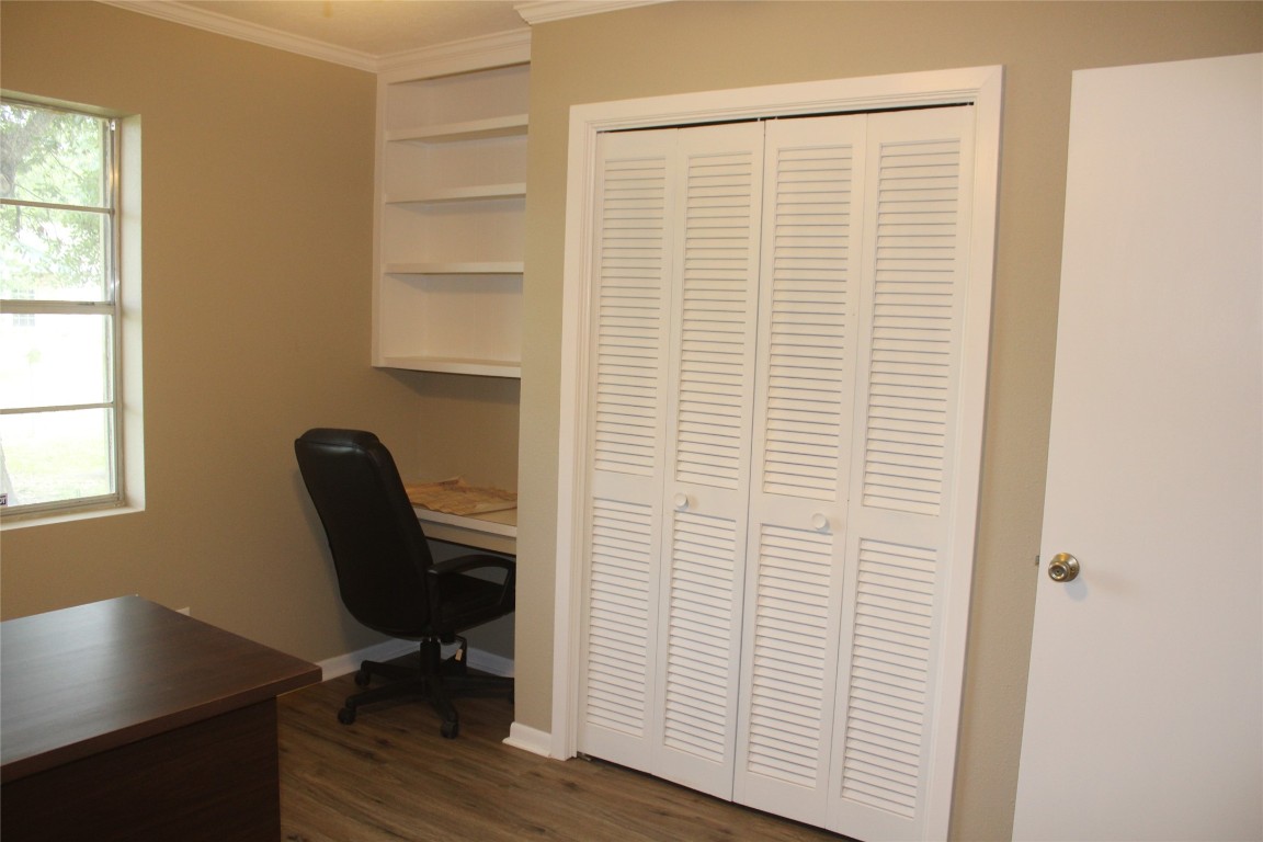 708 1st Street Winnie, TX 77665 - Photo 23 of 35 a view of a workspace with furniture and a window