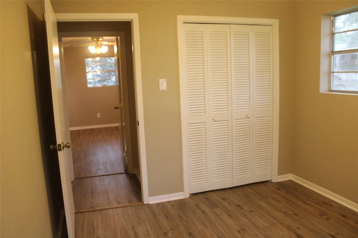 708 1st Street Winnie, TX 77665 - Photo 27 of 35 an empty room with wooden floor and entrance