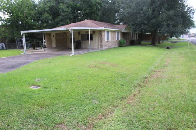 a view of a house with a yard porch and sitting area