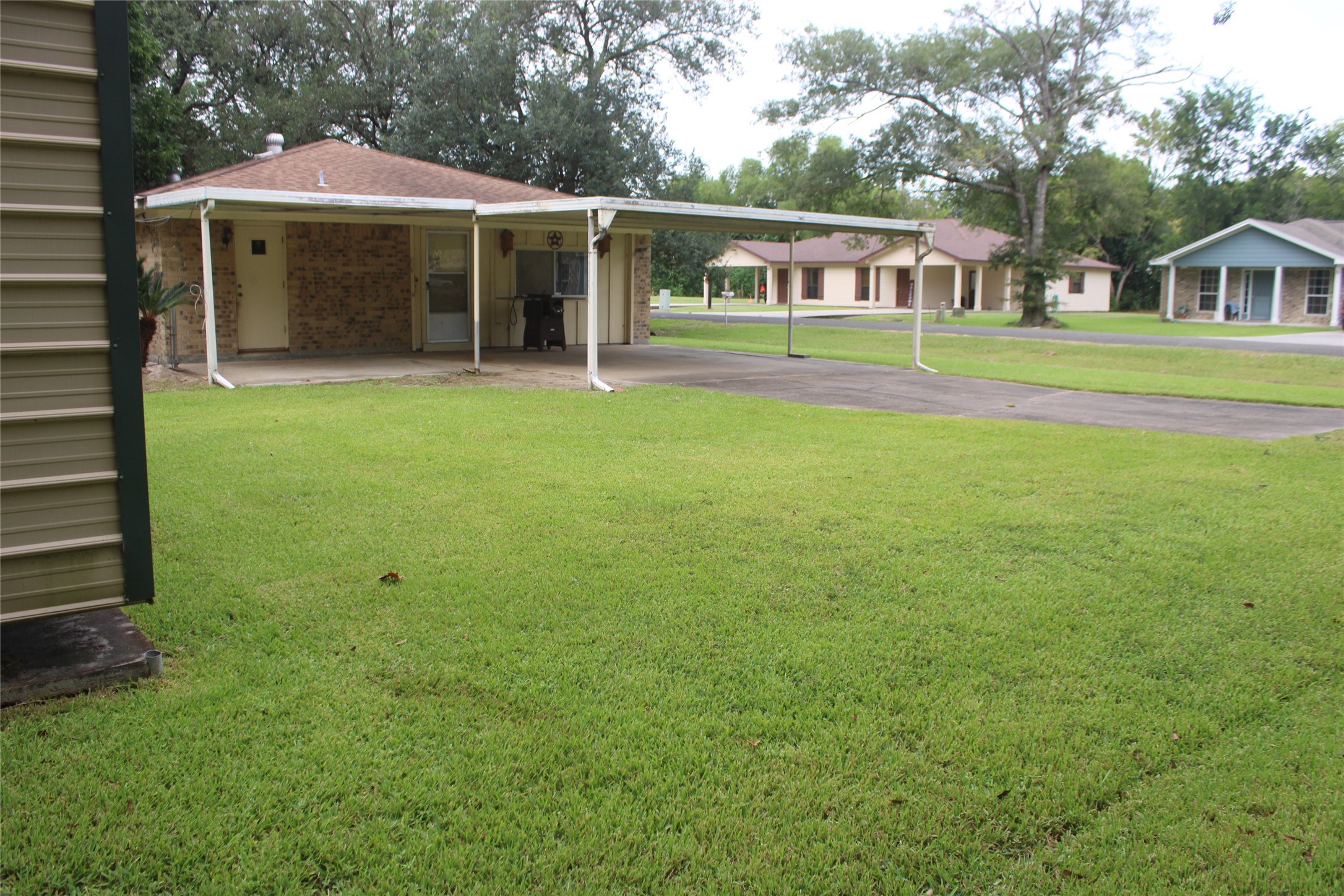 708 1st Street Winnie, TX 77665 - Photo 32 of 35 a front view of a house with a garden