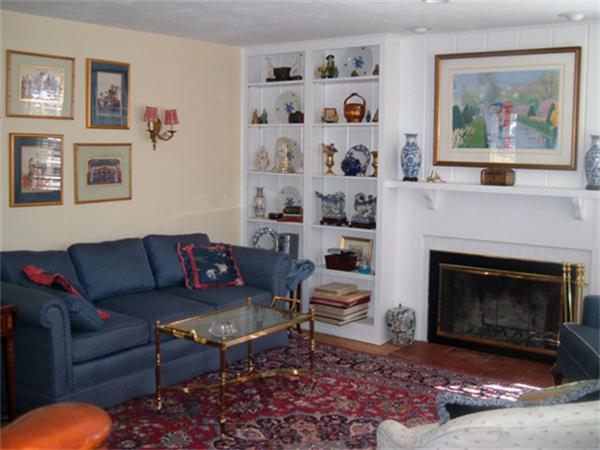 9 Leland Road Natick, MA 01760 - Photo 6 of 11 a living room with furniture a fireplace and a painting