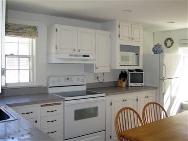 9 Leland Road Natick, MA 01760 - Photo 9 of 11 a kitchen with stainless steel appliances granite countertop a stove a sink dishwasher and a refrigerator