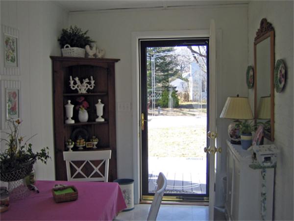 9 Leland Road Natick, MA 01760 - Photo 10 of 11 a bed room with a bed and a potted plant