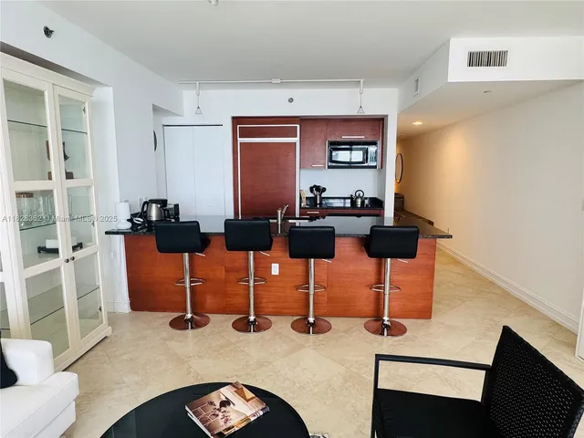a view of dining room and floor to ceiling window