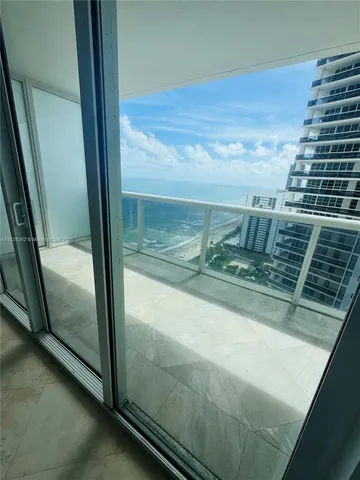 a kitchen with a sink and a refrigerator