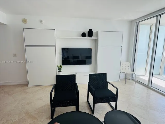 a view of a hallway with wooden walls