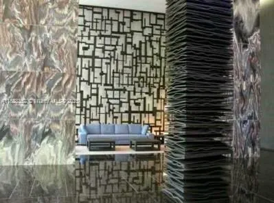 a view of a patio with a table and chairs